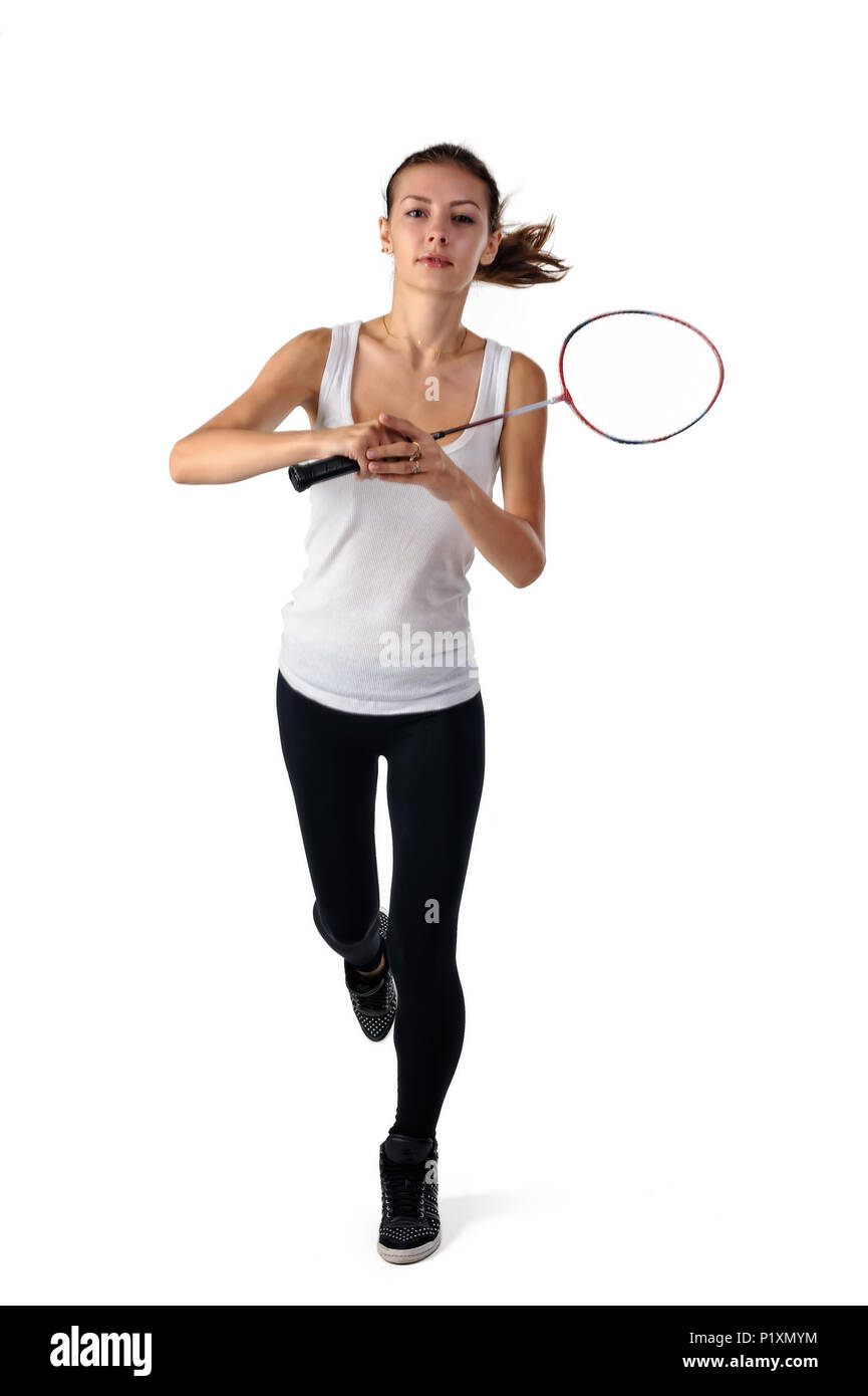 Pretty fit woman holds badminton racket and jumping. Isolated over ...
