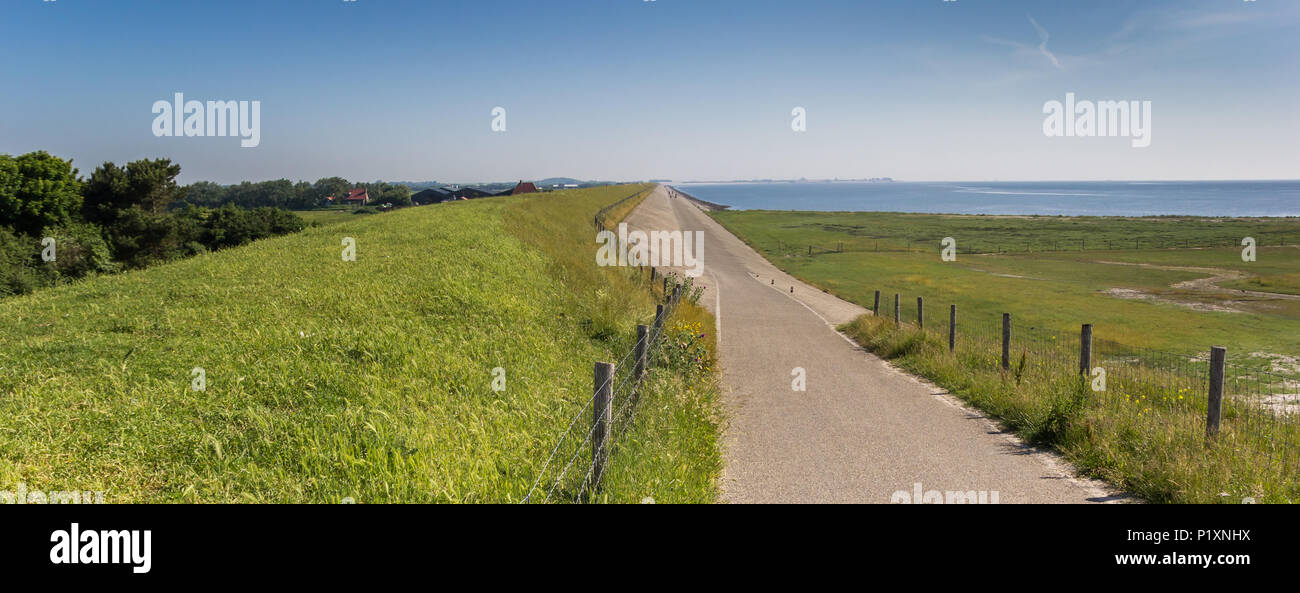 Panorama of a dike road on the Wadden island of Texel, The Netherlands Stock Photo