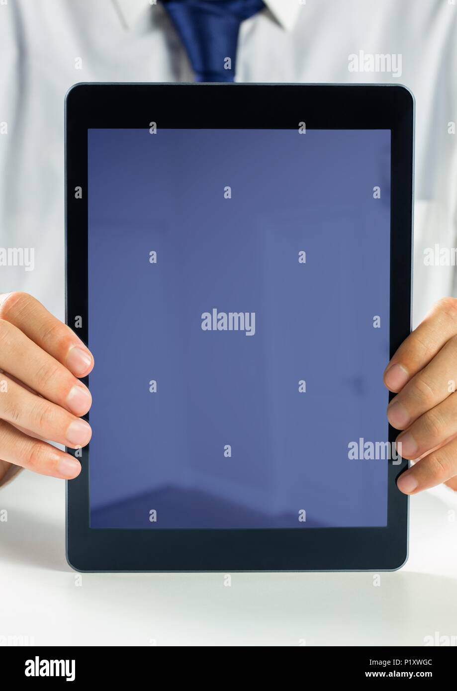 Holding blank screen tablet with businessman Stock Photo