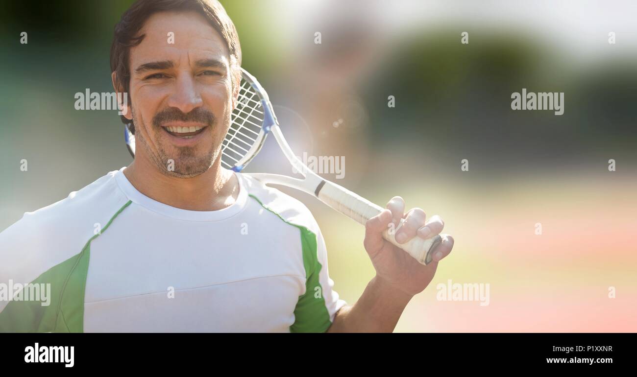Tennis player man with bright background with racket Stock Photo