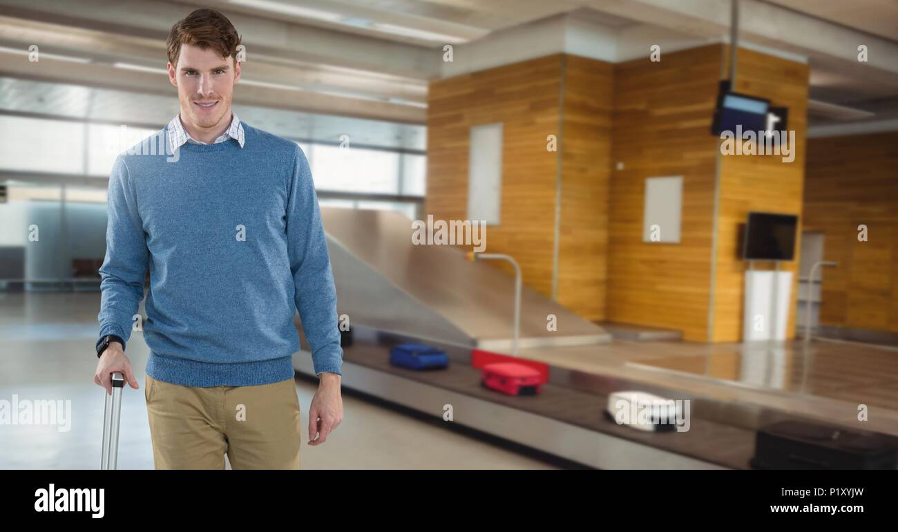 Man at baggage collection in airport Stock Photo