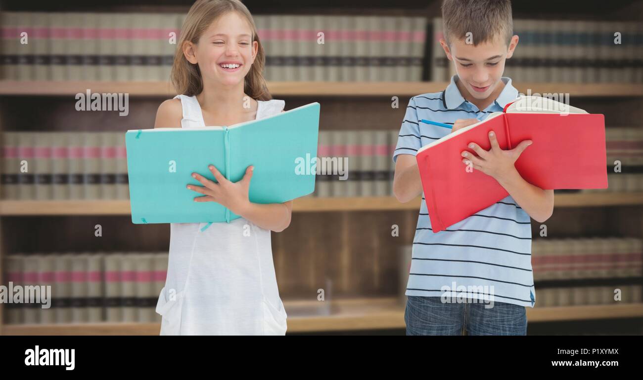 Boy and girl reading in education library Stock Photo - Alamy