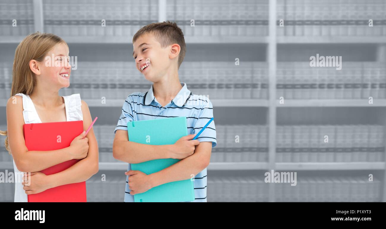 Boy and girl in education library Stock Photo - Alamy