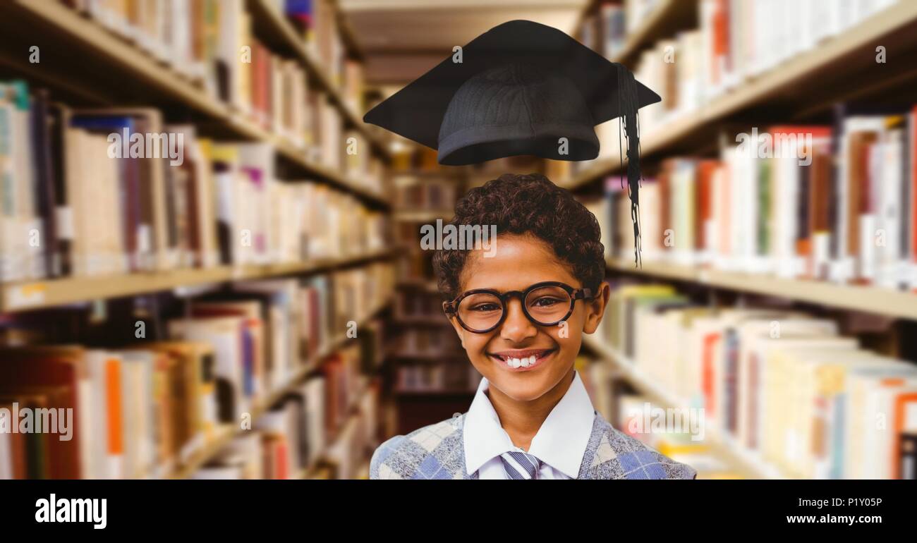 School boy in education library with graduation hat Stock Photo