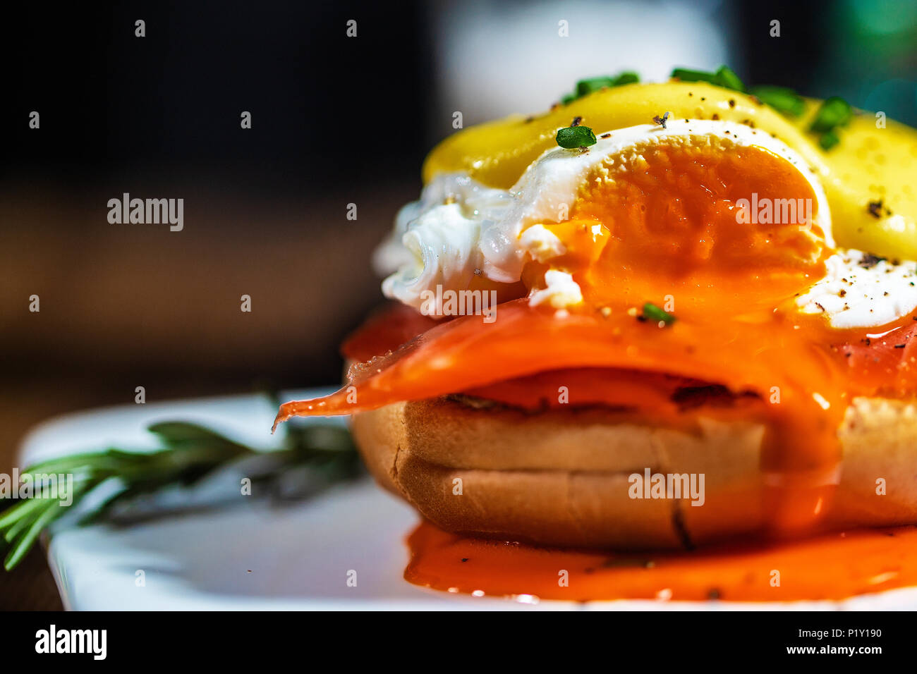 Egg Benedict with smoked salmon and fresh Hollandaise sauce Stock Photo