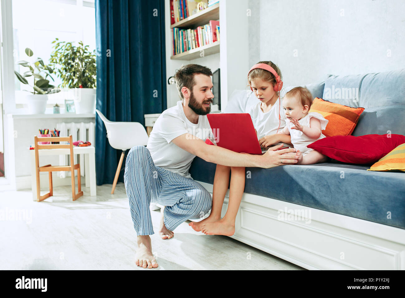 father and his daughters at home Stock Photo - Alamy