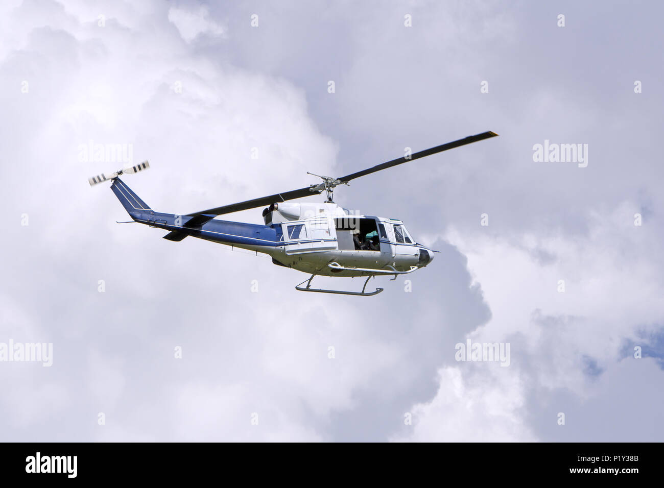 Blue helicopter flight in the sky Stock Photo