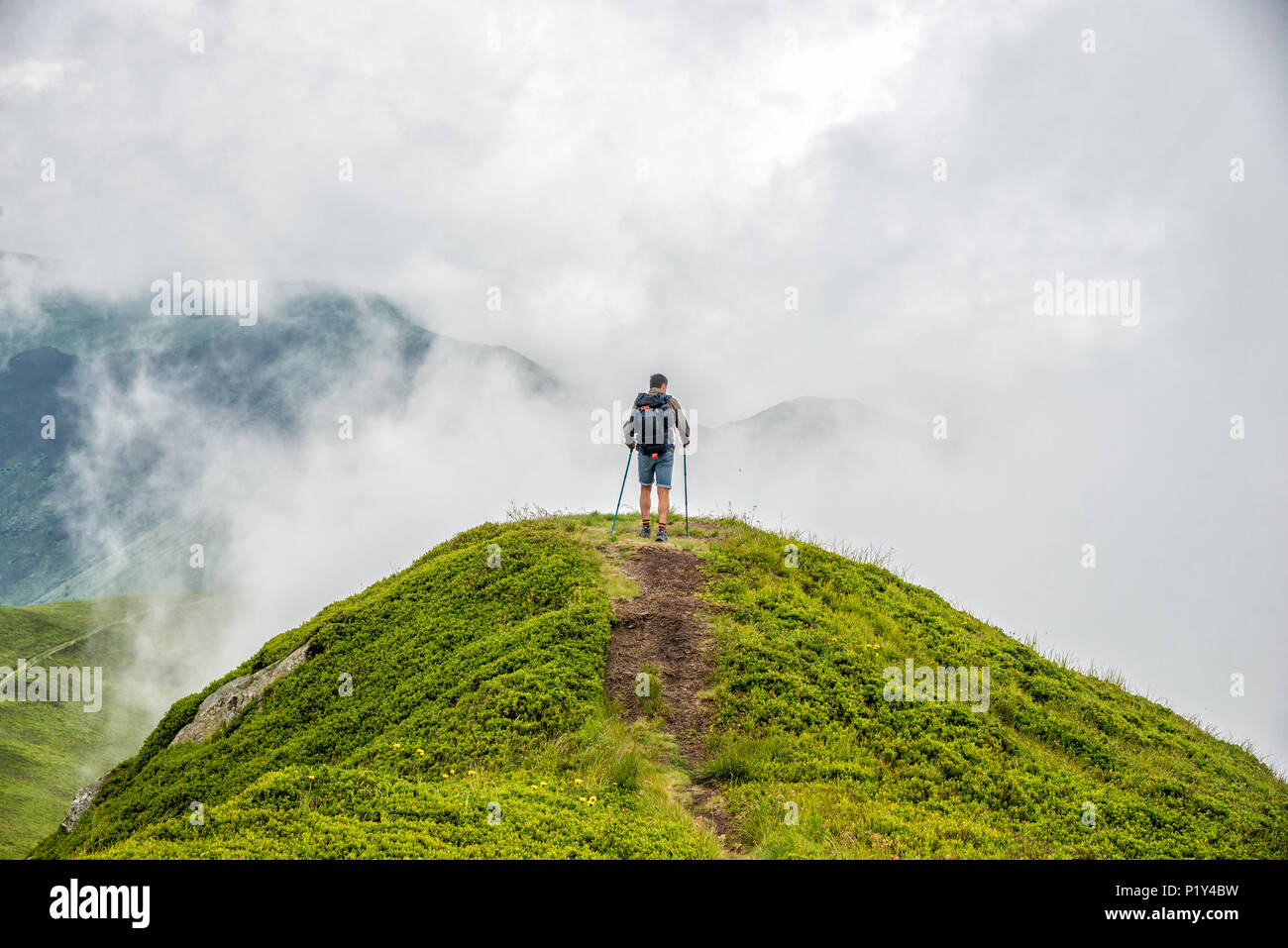 man standing on the peak of the mountain Stock Photo - Alamy