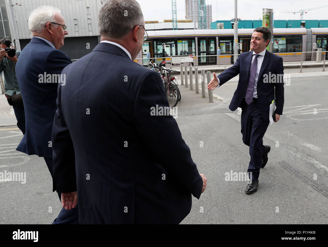Minister for Finance Paschal Donohoe (right) is greeted by NAMA Chairman Frank Daly (left) and NAMA Chief Executive Brendan McDonagh on arrival at the Gibson Hotel, Dublin, for the launch of the NAMA Annual Report and Financial Statements for 2017. Stock Photo