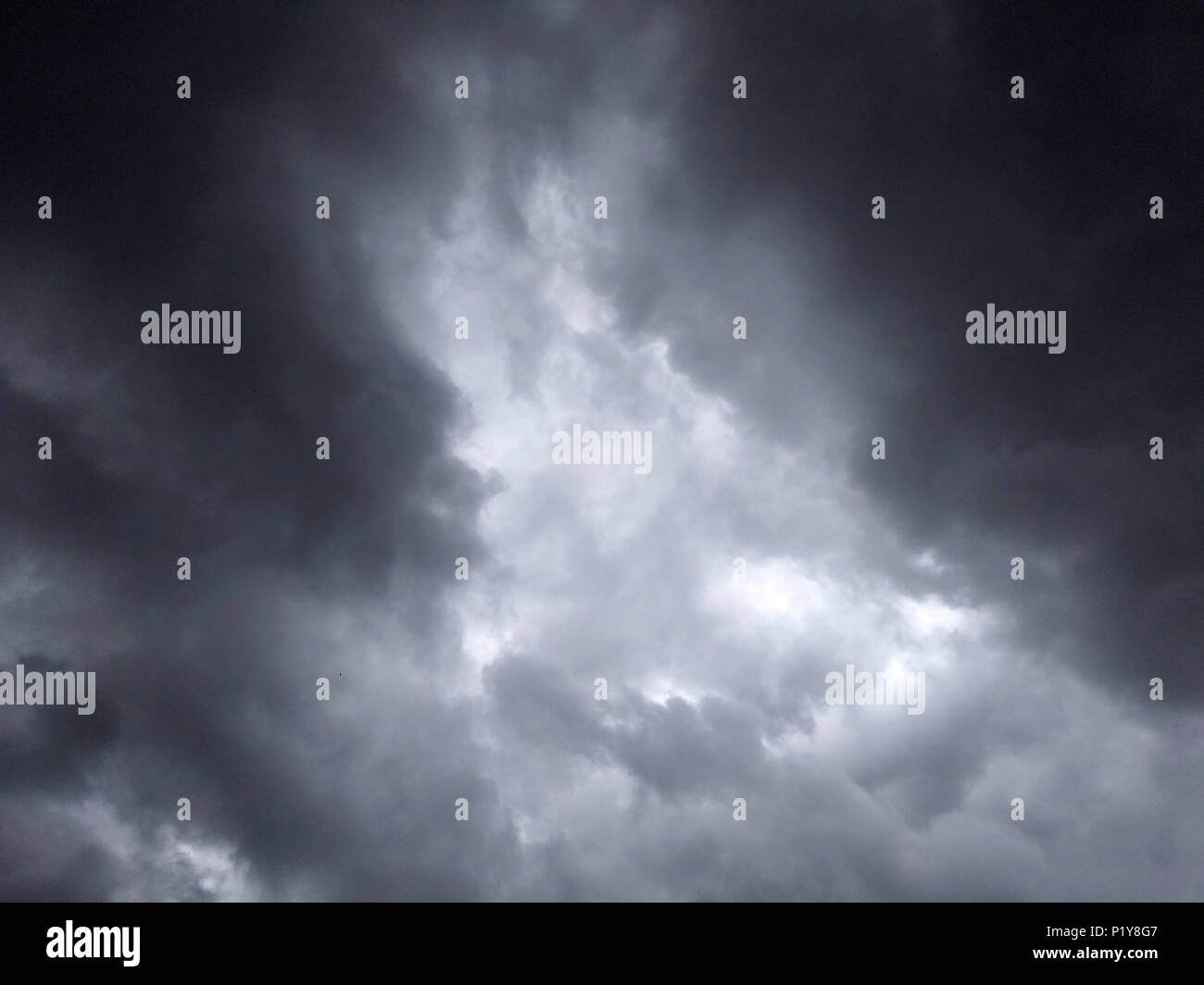 dark dense gloomy dramatic thundercloud on summer day Stock Photo