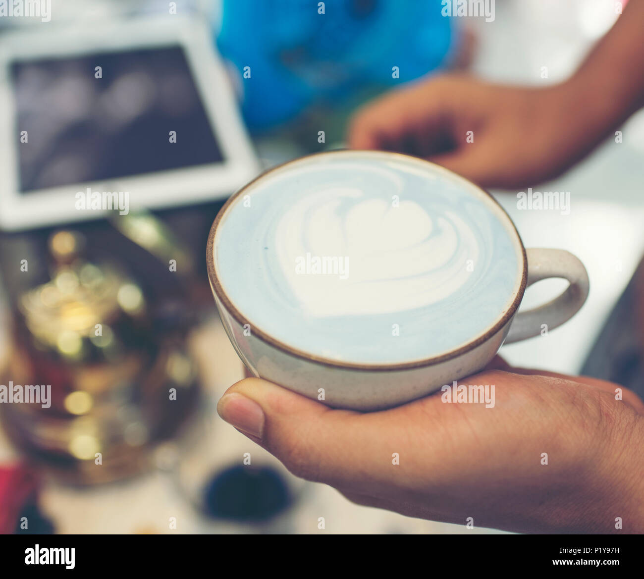 blue latte art coffee process, vintage filter image Stock Photo Alamy
