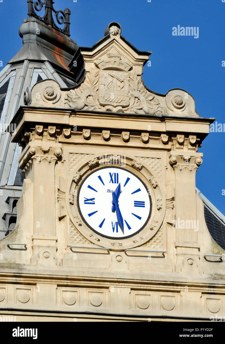 France, Ile de France, Paris, 11th district, clock on the facade of ...