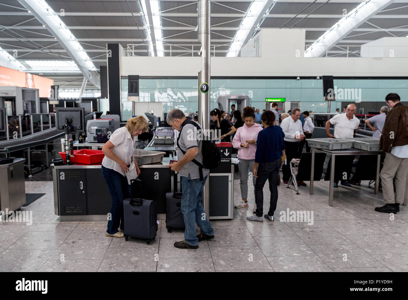 LONDON - MAY 27, 2018: People at security check at London Heathrow airport terminal Stock Photo