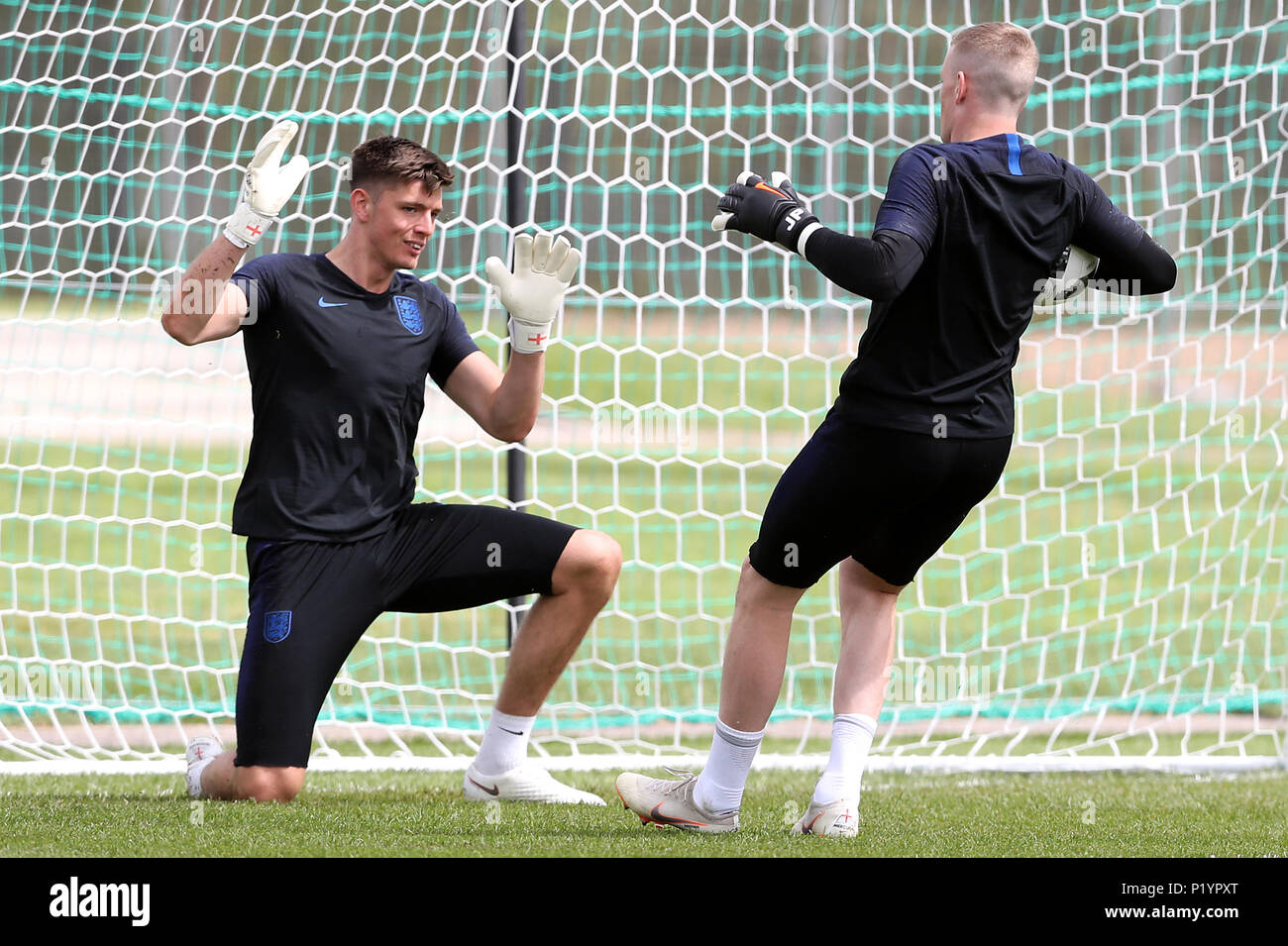 England goalkeepers Nick Pope (left) and Jordan Pickford during the training session at the Spartak Zelenogorsk Stadium, Repino. Stock Photo