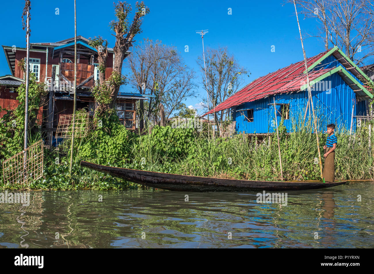 Myanmar, Shan region, lake Inle, dugout and houses on stilts on the ...