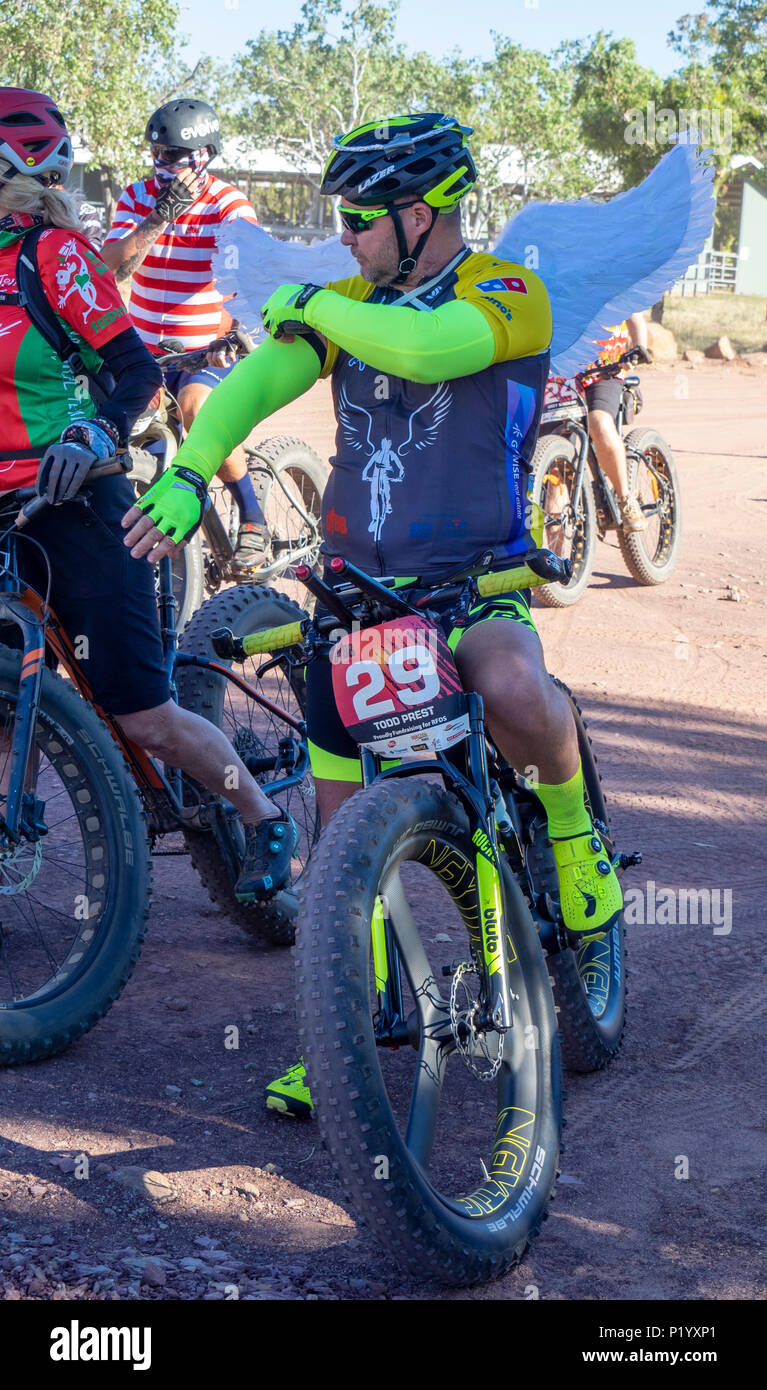 Gibb Challenge 2018  cyclists dressed in bib and jersey and costume on Fat bikes leaving Home Valley Station Gibb River Road Kimberley WA Australia Stock Photo