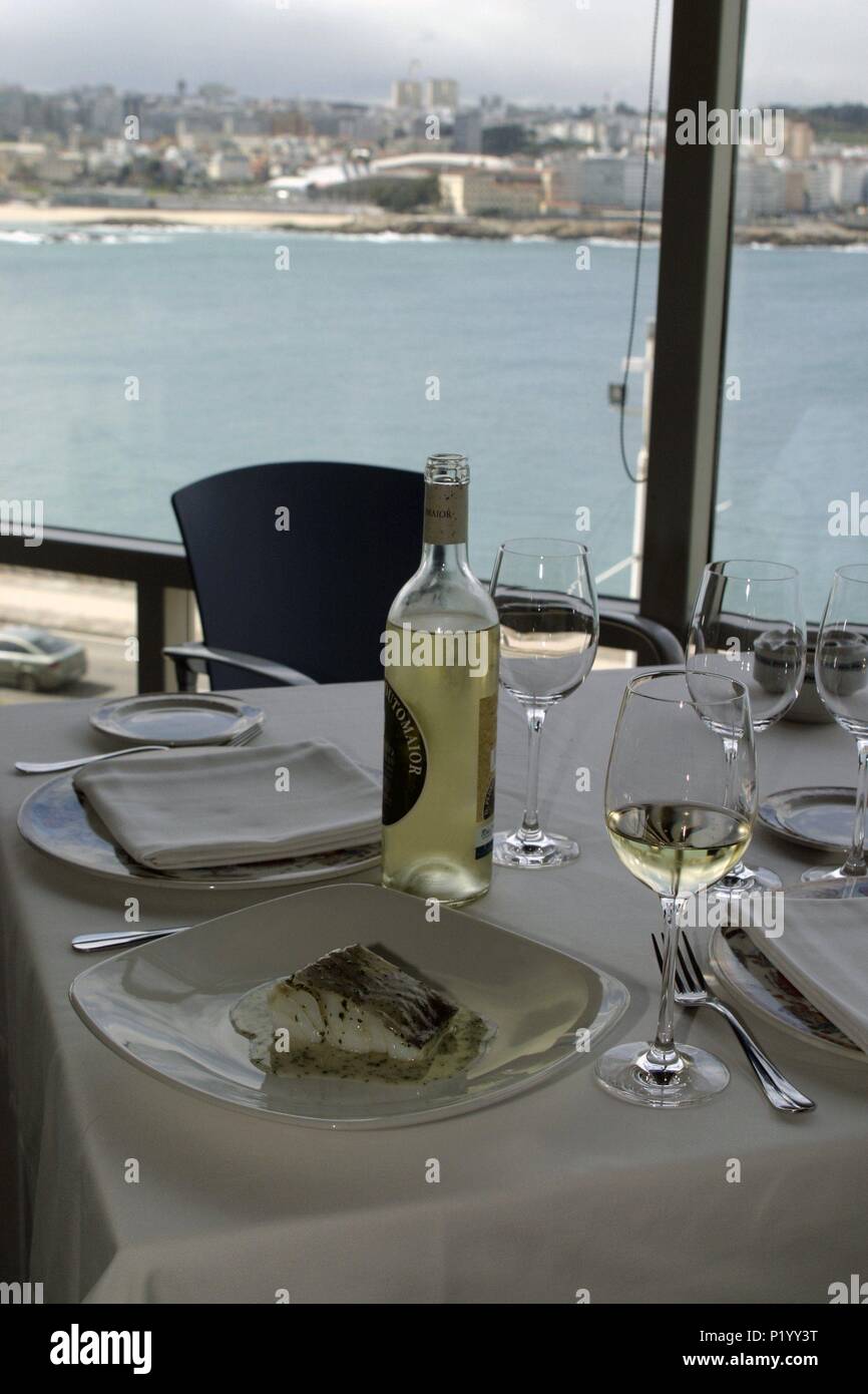 A / La Coruña; restaurante 'Domus' con vistas a playas de Orzan y Riazor; bacalao en su salsa. Stock Photo