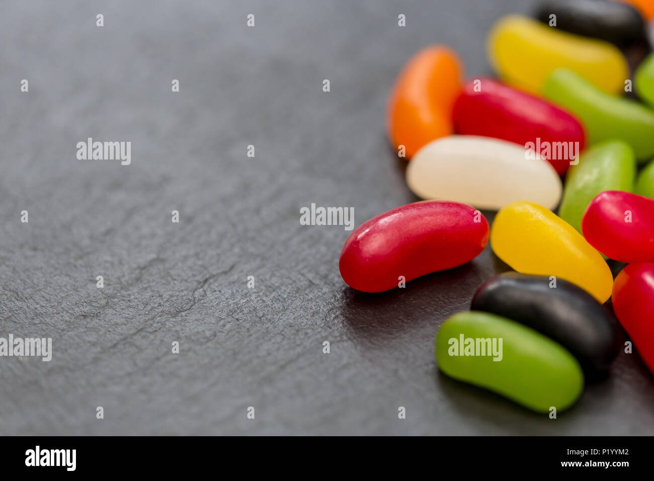 Jelly beans candy sweets on dark background Stock Photo
