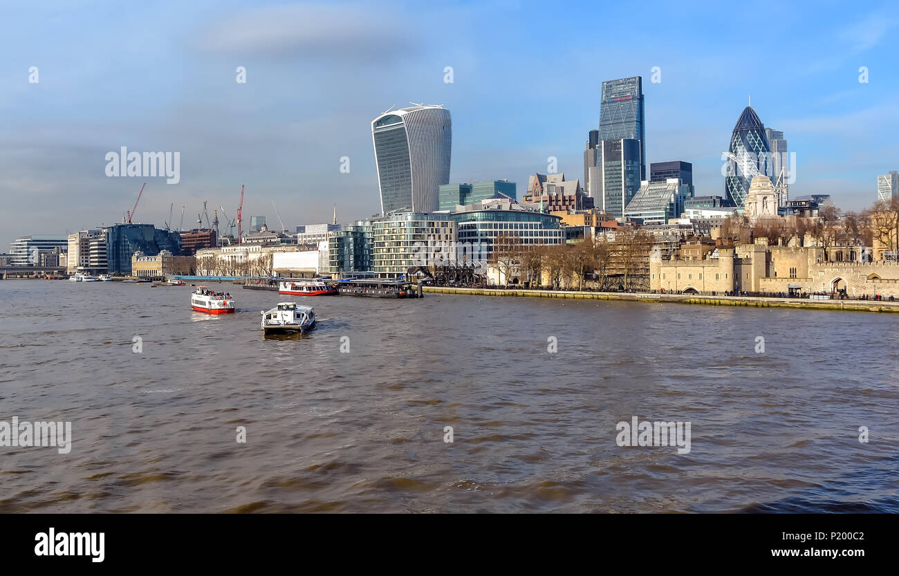 The City of London skyline, including boats in the Thames waters and