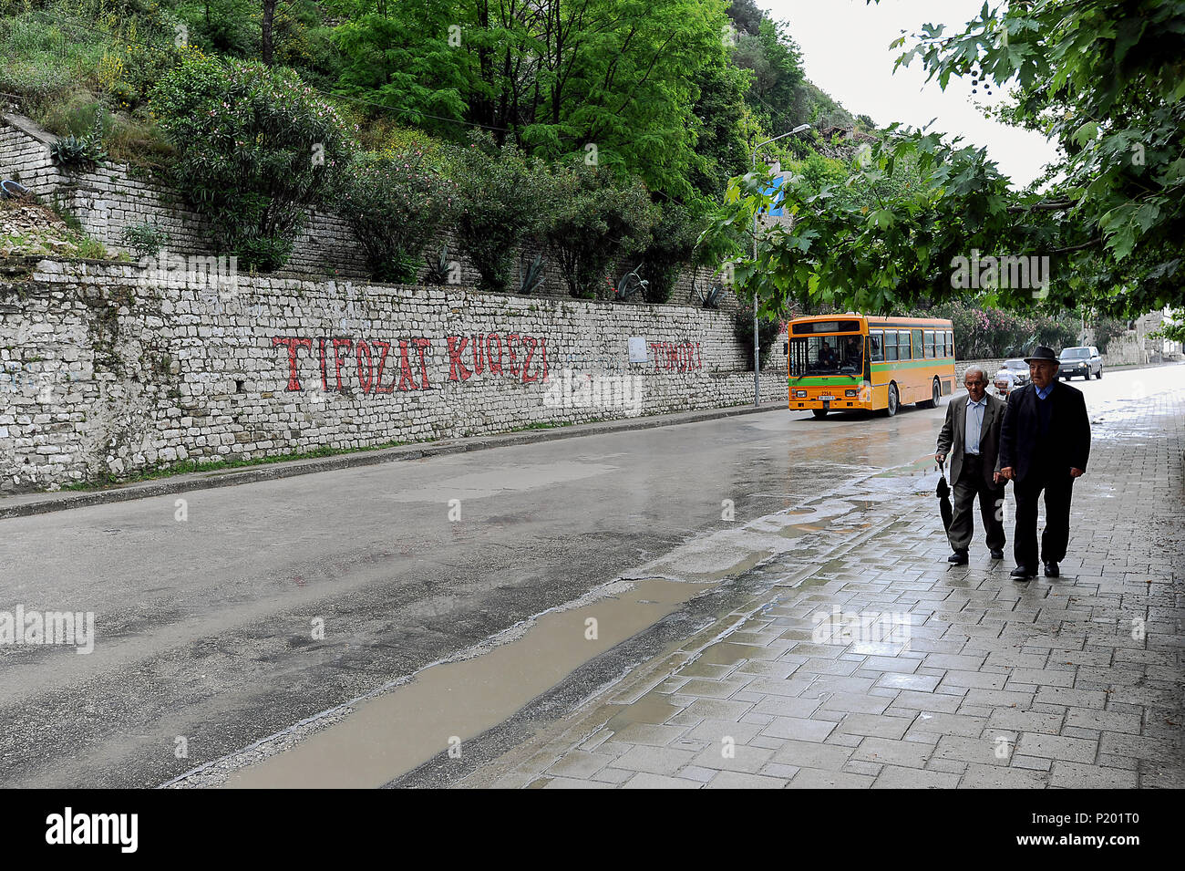 Berat, Albania, men run through the streets Stock Photo