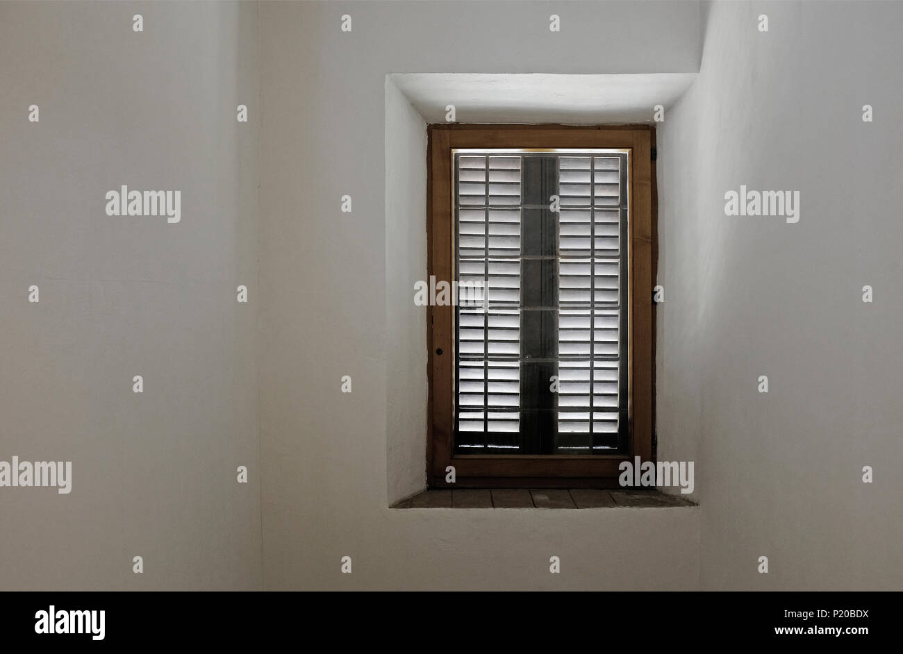 wooden window in white painted room, tuscany, italy Stock Photo
