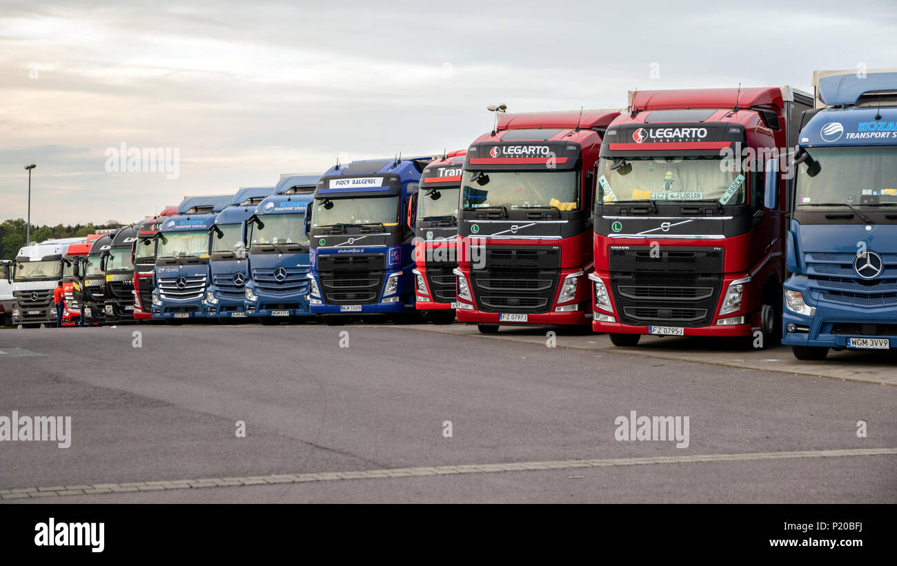 A2 HIGHWAY, GERMANY - APRIL 28, 2018: Row of cargo trucks on an overnight parking lot along the A2 Autobahn highway in Germany. Stock Photo