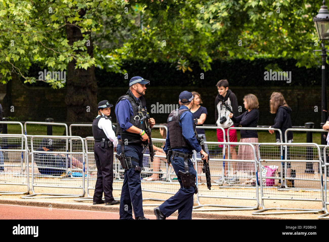 Armed Police officers of The Specialist Firearms Command SCO19  patrolling the crowds at The Trooping Of The Colour Ceremony, The Mall ,London, UK Stock Photo