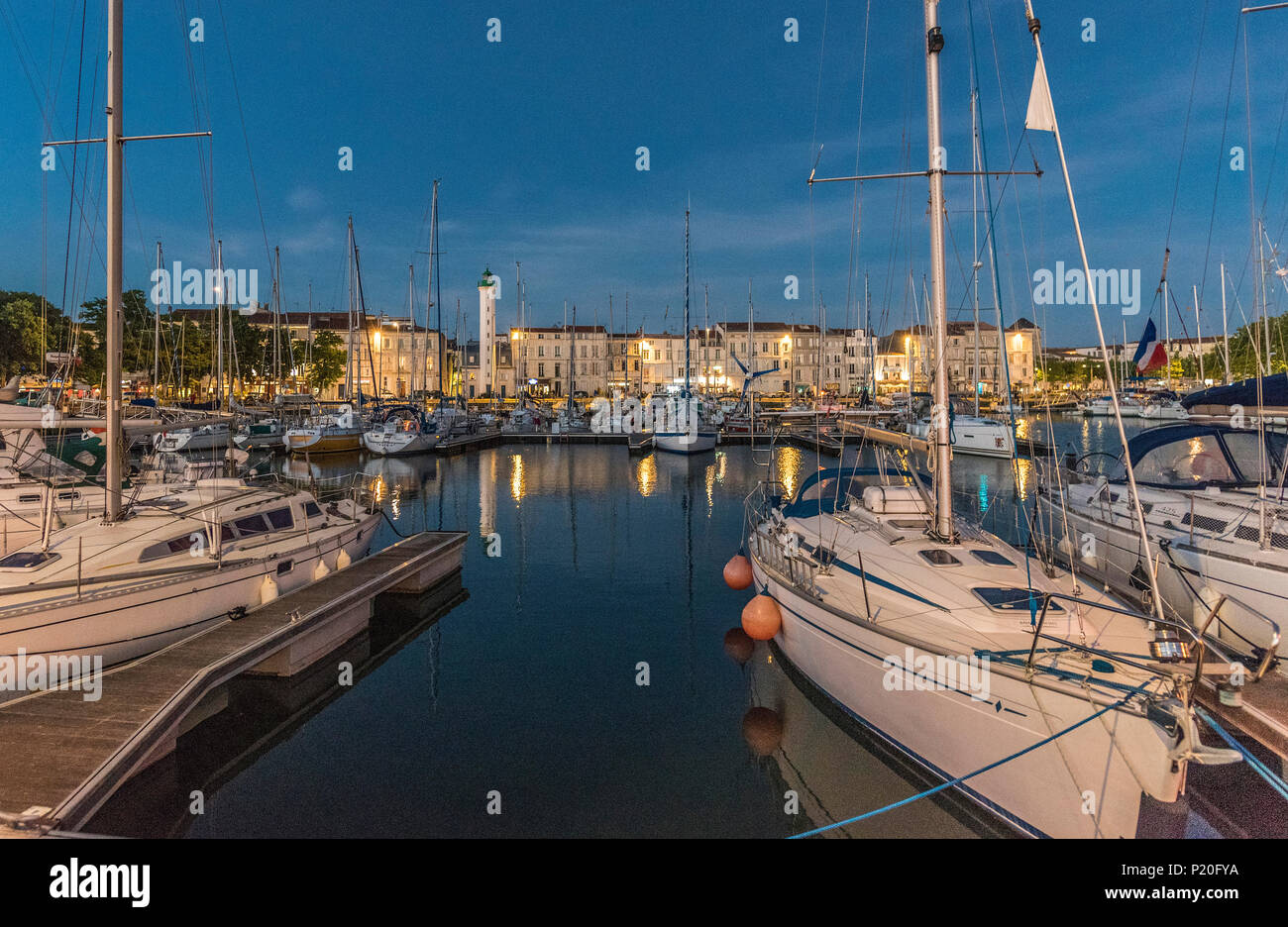 France, Charente-Maritime, La Rochelle, sailing boats on the Bassin a Flot in front of quia Valin at night Stock Photo