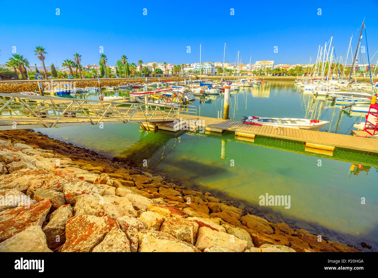 Beautiful landscape of yacht, charter and motorboats in Marina de Lagos. The Marina is located in Bay of Lagos, Algarve coast, Portugal, Europe. Summe Stock Photo