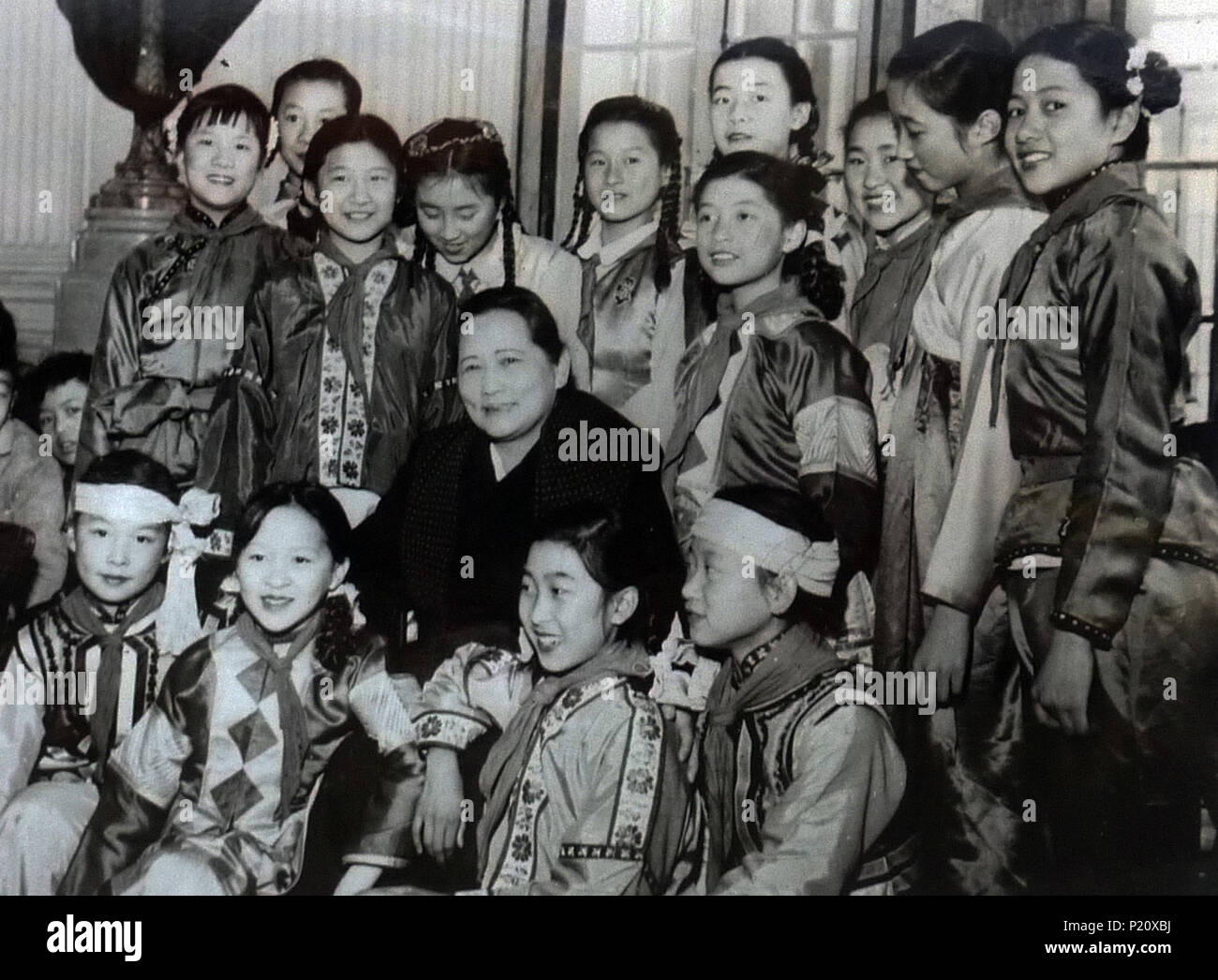 Shanghai. 13th June, 2018. File photo taken in Jan. 1960 shows Soong Ching Ling posing with kids at the Children's Palace under the China Welfare Institute (CWI) during the Chinese Spring Festival in Shanghai, east China. This year marks the 80th anniversary of the CWI, founded by Soong Ching Ling in 1938. The Shanghai-based organization focuses on maternal and child health, education and social welfare. Soong Ching Ling, born in Shanghai in 1893, was the wife of Chinese revolutionary Dr. Sun Yat-sen, who led the 1911 Revolution. Credit: CWI/Xinhua/Alamy Live News Stock Photo