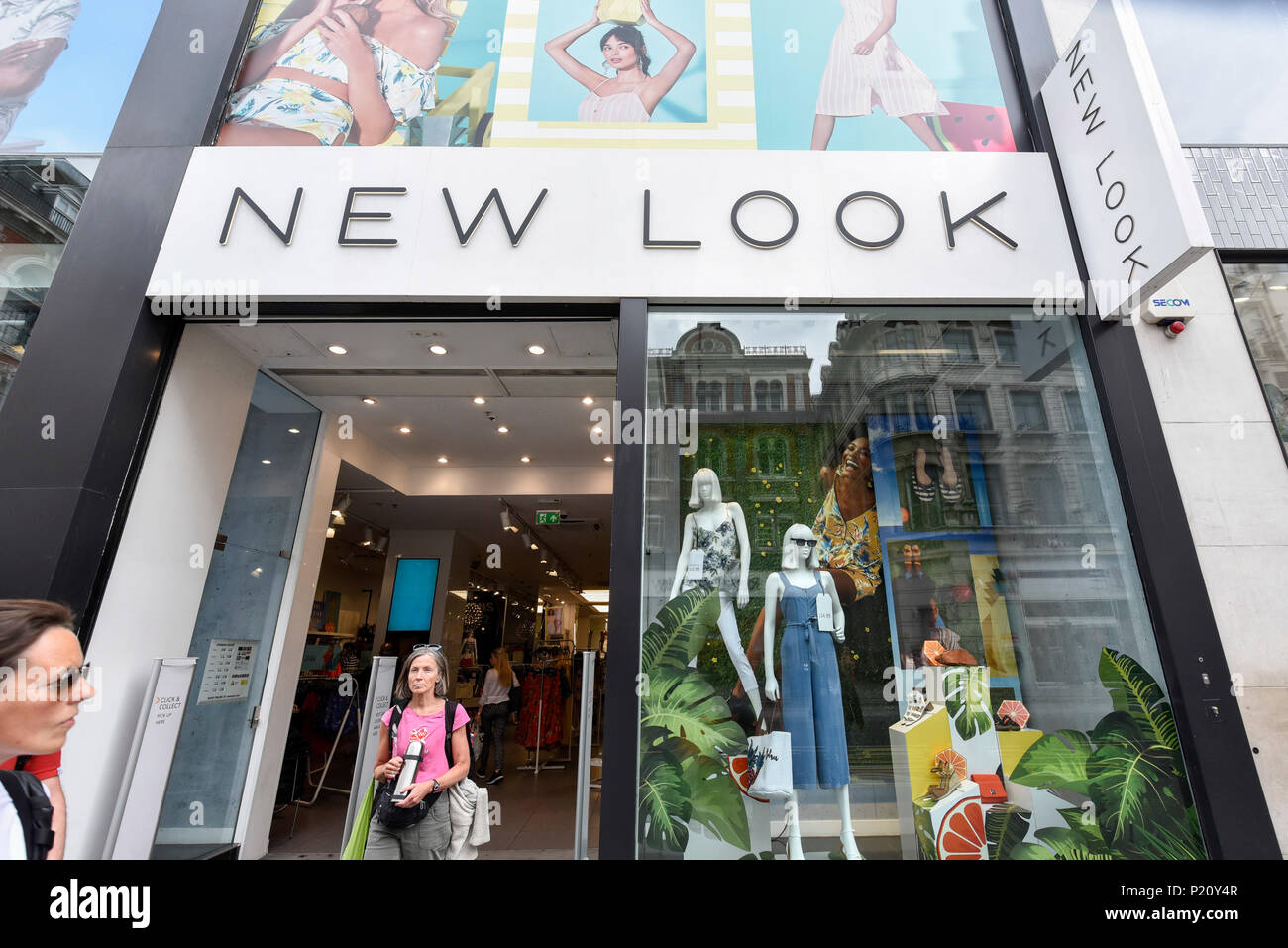 London, UK.  13 June 2018.   Shoppers pass by the New Look store on Tottenham Court Road.  The New Look fashion chain has incurred an annual loss of nearly £235m with sales down 12% to £1.3bn in the year to 24 March.  The company has launched a company voluntary arrangement (CVA), to save property rental costs and restructure with up to 60 of its 593 stores, including the one on Tottenham Court Road, expected to close.  House of Fraser, also recently announced that its Oxford Street flagship will close, also as part of CVA restructuring plan.  Credit: Stephen Chung / Alamy Live News Stock Photo