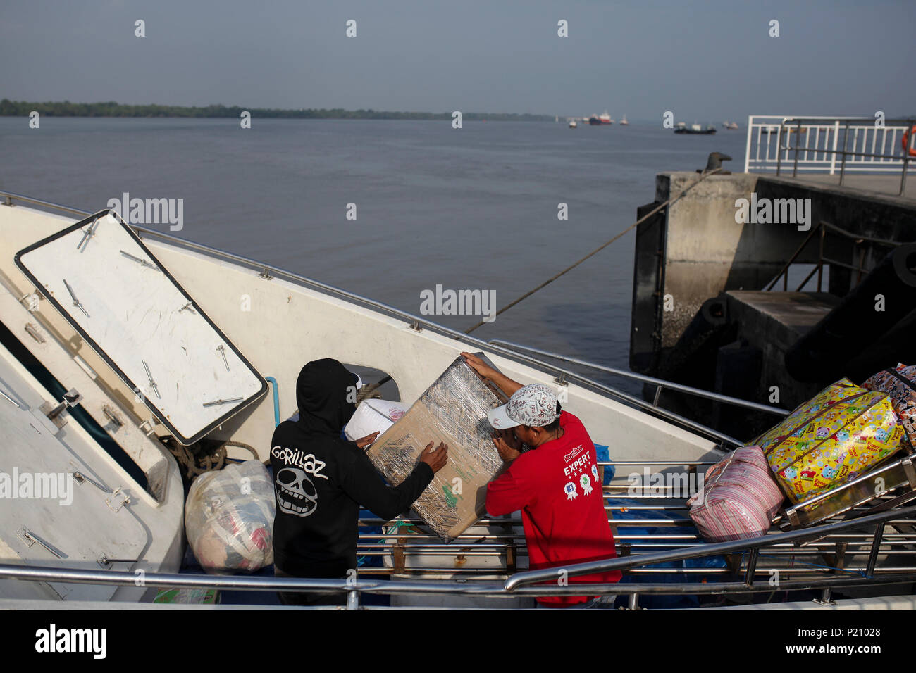 Ferry Workers Loading Up Passengers Belonging And Luggage In Port Klang Ferry Terminal Before Departing To Tanjung Balai Thousand Of Indonesian Who Work And Live In Malaysia Were Expected To Return Home