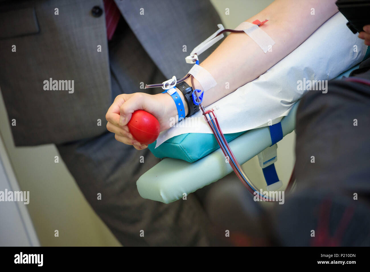 13 June 2018, Germany, Berlin: The arm of a patient during a platelet donation at the Charite hospital. The World Blood Donor Day is held on the 14 June which is the birthday of Karl Landsteiner, the discoverer of blood types. Photo: Gregor Fischer/dpa Stock Photo