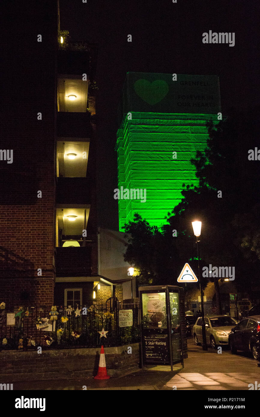 London, UK. 14th June, 2018. The Green for Grenfell illuminations are lit at the Grenfell Tower and the twelve closest tower blocks on the first anniversary of the fire in a display intended to 'shine a light' of love and solidarity for all those affected and to raise awareness of the plight of those still without new homes after one year. Green for Grenfell is a community-led initiative in collaboration with tenants' and residents' associations and Grenfell United. Credit: Mark Kerrison/Alamy Live News Stock Photo