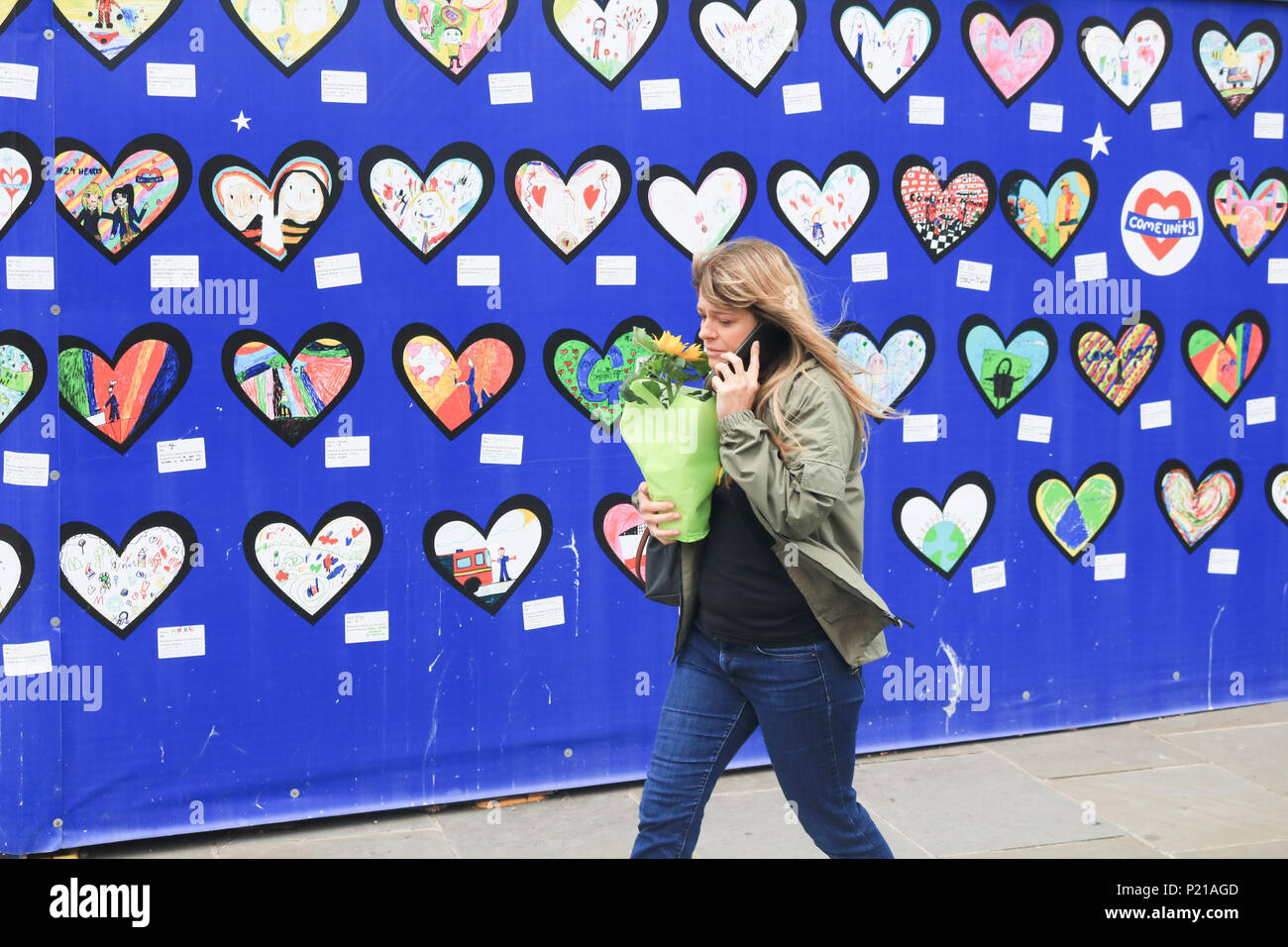 London UK. 14th June 2018. Grenfell anniversary a year after the fire  in West London which claimed the lives of 72 residents in the tower block.  A minute's silence will be observed nationally at midday to rembers the victims of the Grenfell fire on 14 June 2018. Credit: amer ghazzal/Alamy Live News Stock Photo