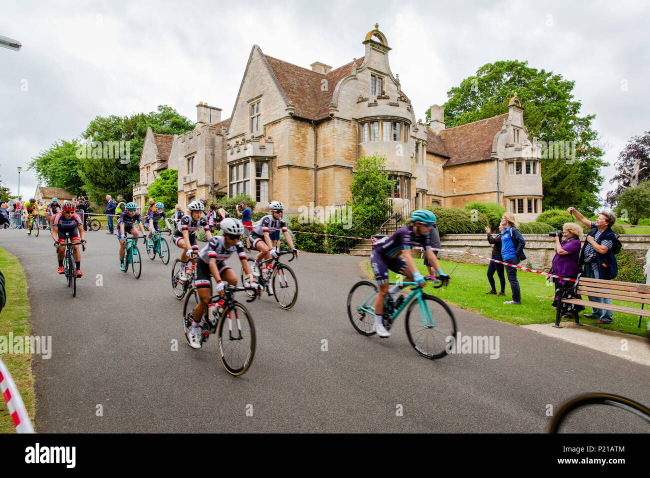 Day two of the Grand Depart from Rushden, Northamptonshire of the OVO Energy Women's Cycle Tour 2018. The cyclists depart from Hall Park in the centre of Rushden past Rushden Hall. Credit: GLC Pix/Alamy Live News: Rushden, UK. 14th June 2018. Stock Photo