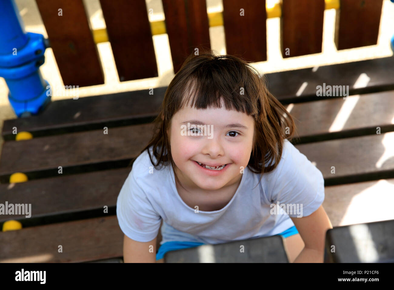 Portrait of little girl smiling in the park Stock Photo - Alamy