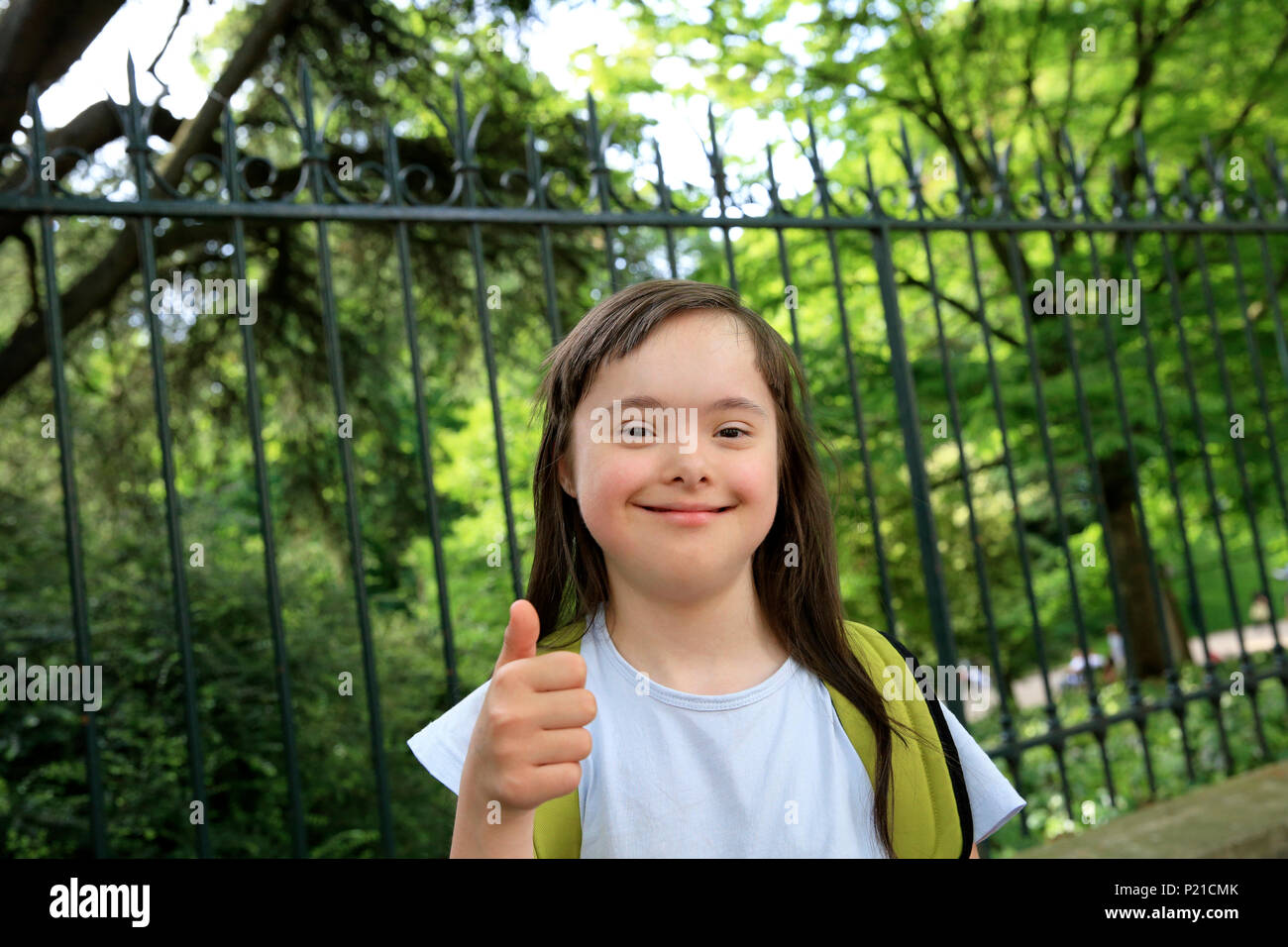 Portrait of little girl smiling in the park Stock Photo