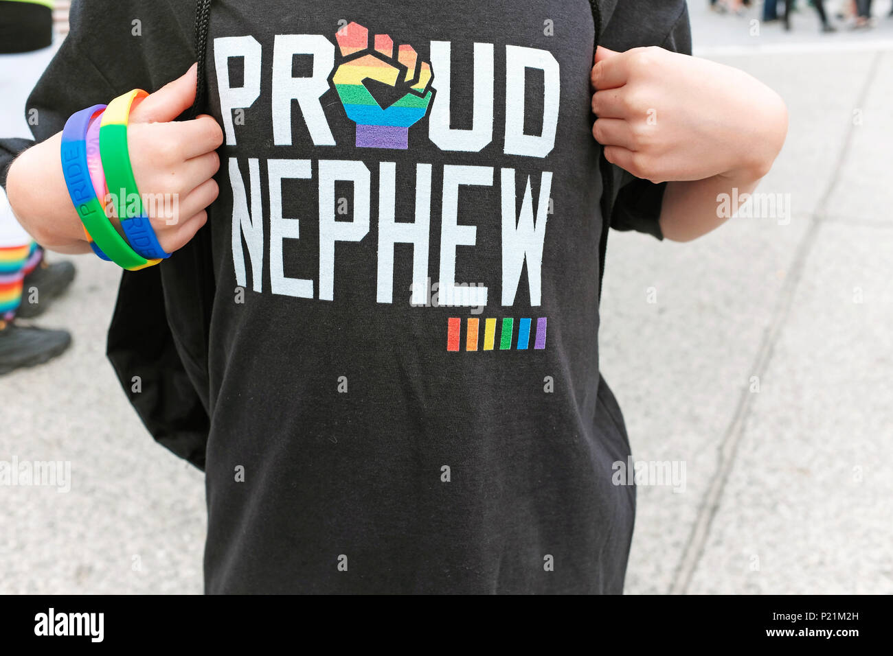 A kid shows off his 'Proud Nephew' t-shirt at the Cleveland, Ohio Pride March and Celebration. Stock Photo