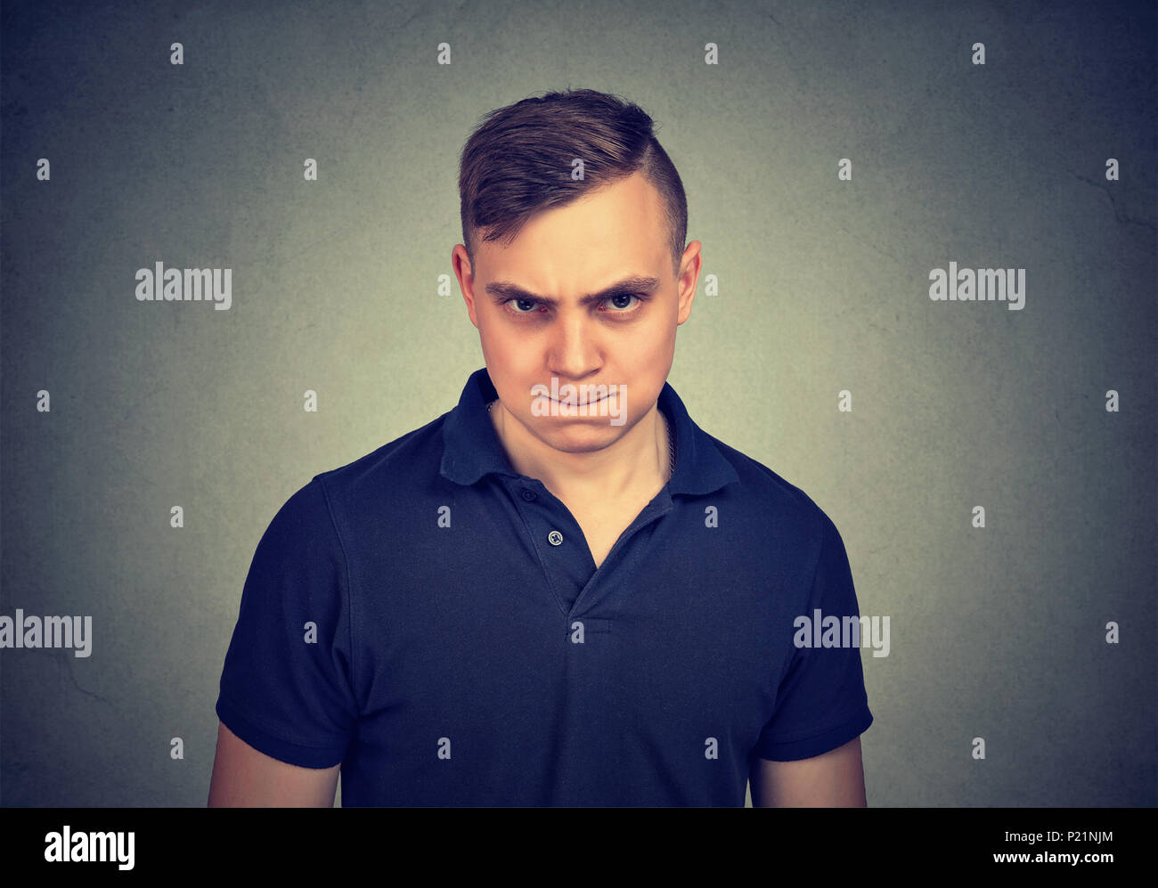 Angry man looking at camera Stock Photo