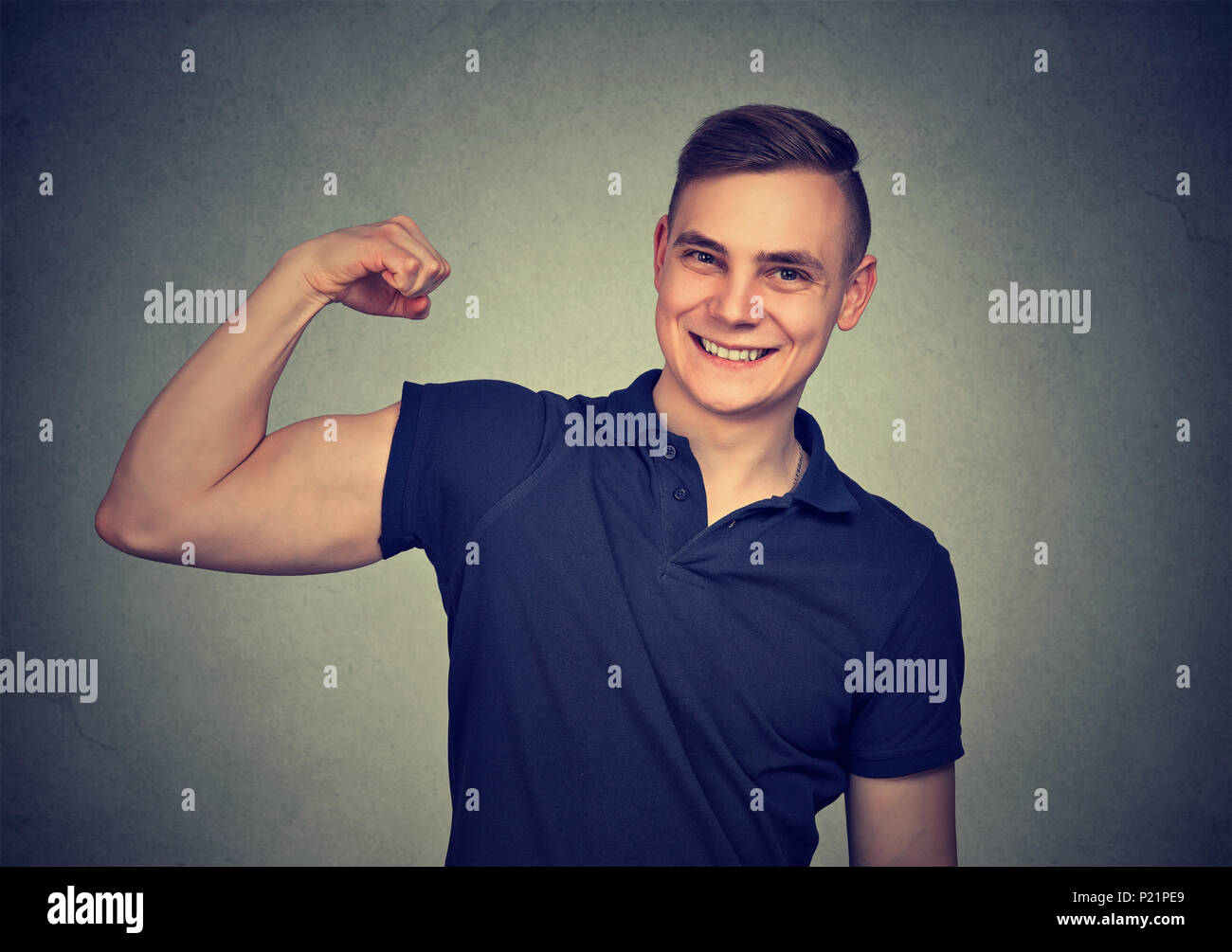 Man flexing his bicep Stock Photo