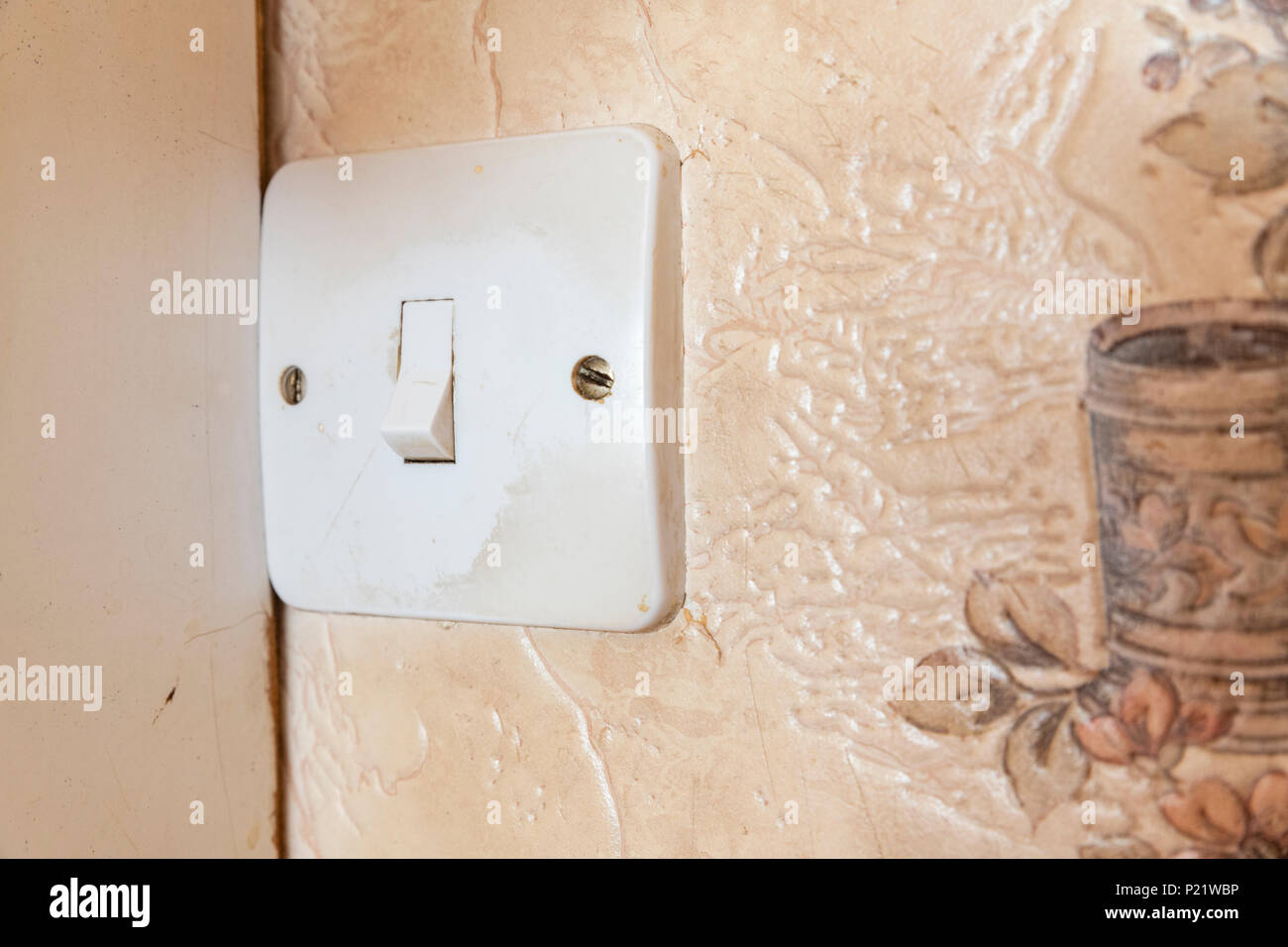 Dirty light switch in an old fashioned kitchen Stock Photo