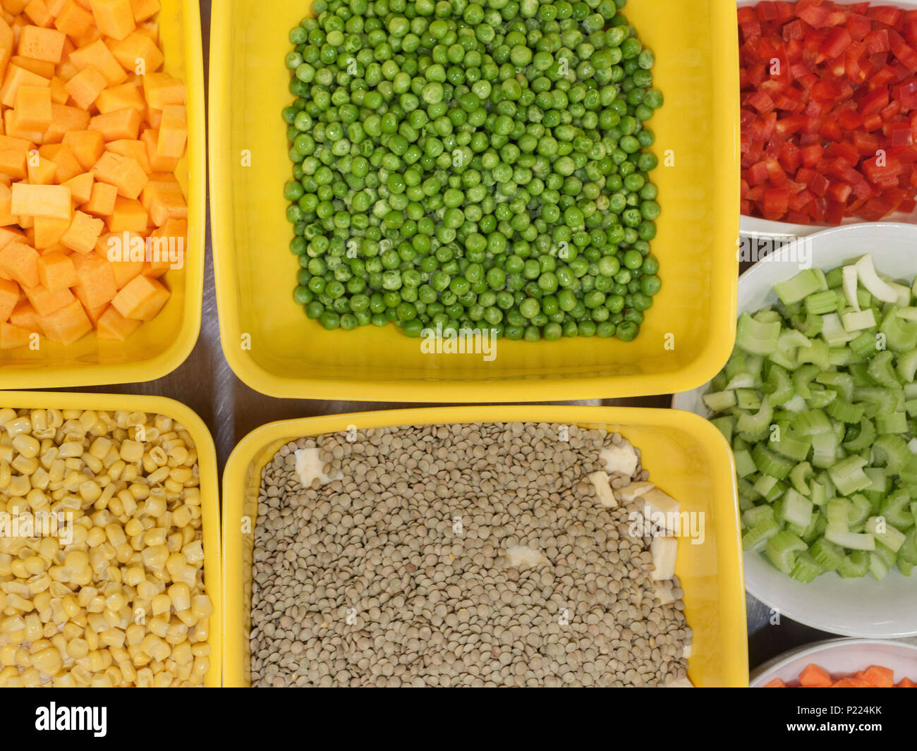 Bowls of fresh and diced vegetables. Stock Photo