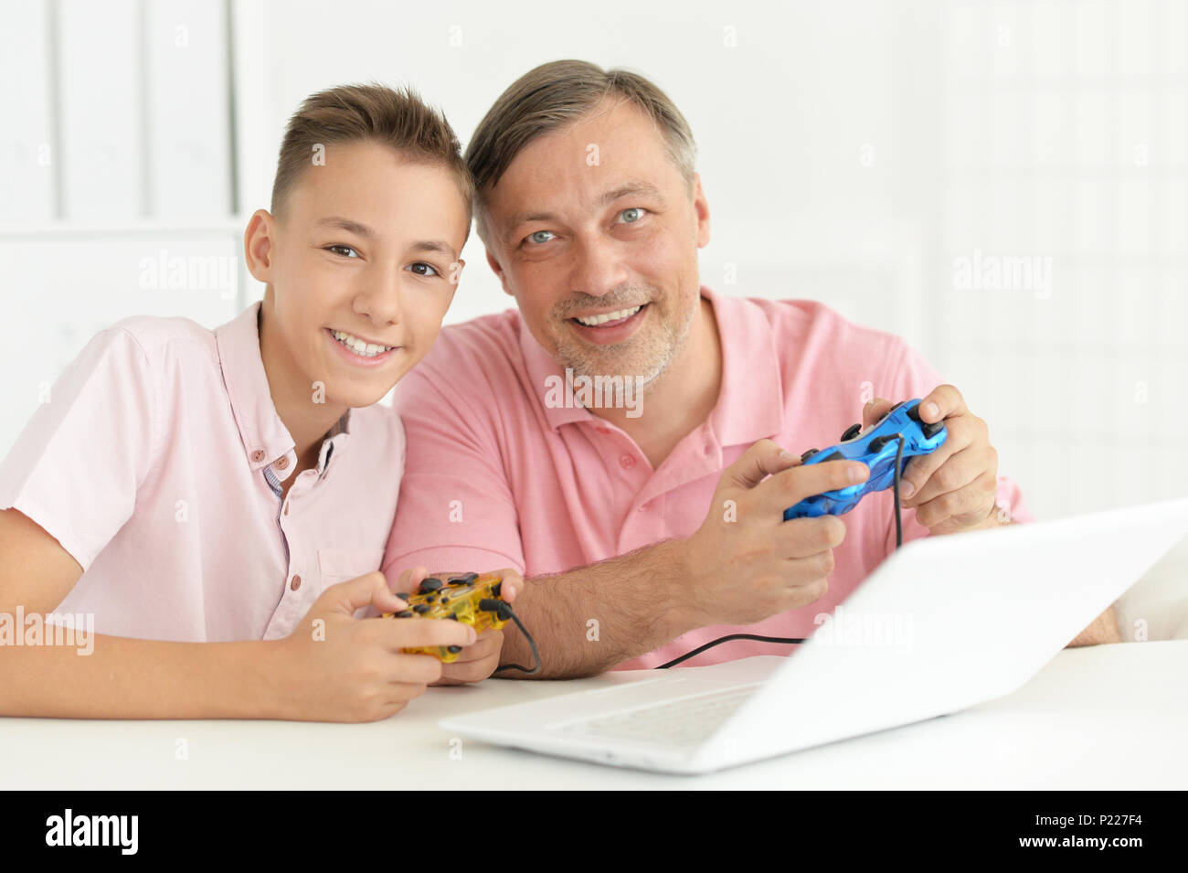 portrait of happy father and son playing Stock Photo