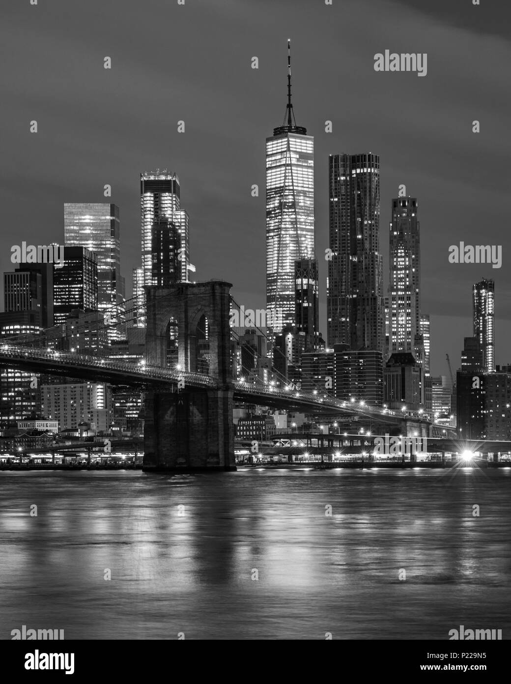 Brooklyn Bridge, Manhattan and the World Trade Center at dawn across the East River from Brooklyn, New York, USA Stock Photo