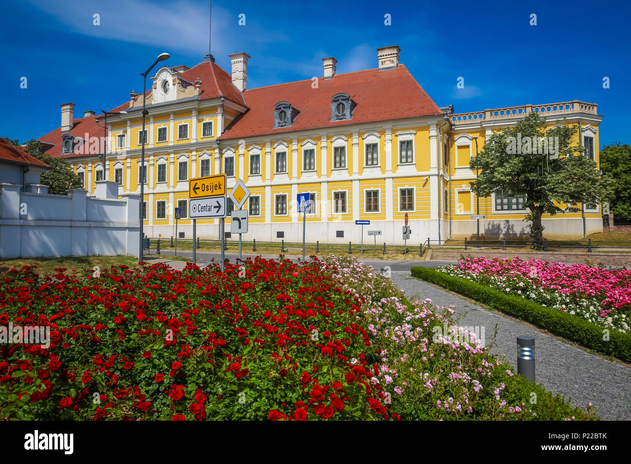 A view of the flowers in park with the City museum located in the Eltz castle in Vukovar, Croatia. Stock Photo