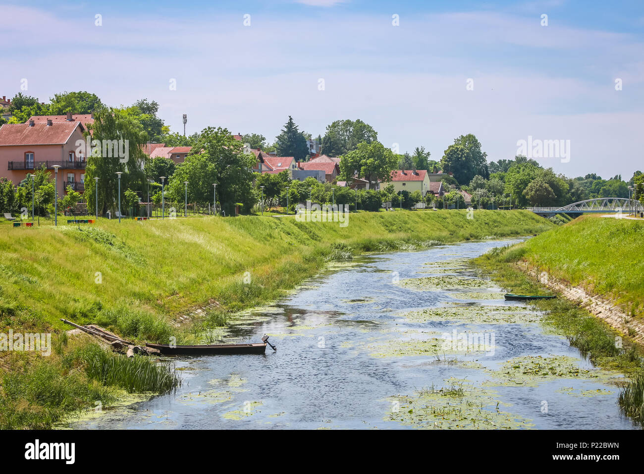 A view of the water channel of river Vuka with with motor boat in Vukovar, Croatia. Stock Photo