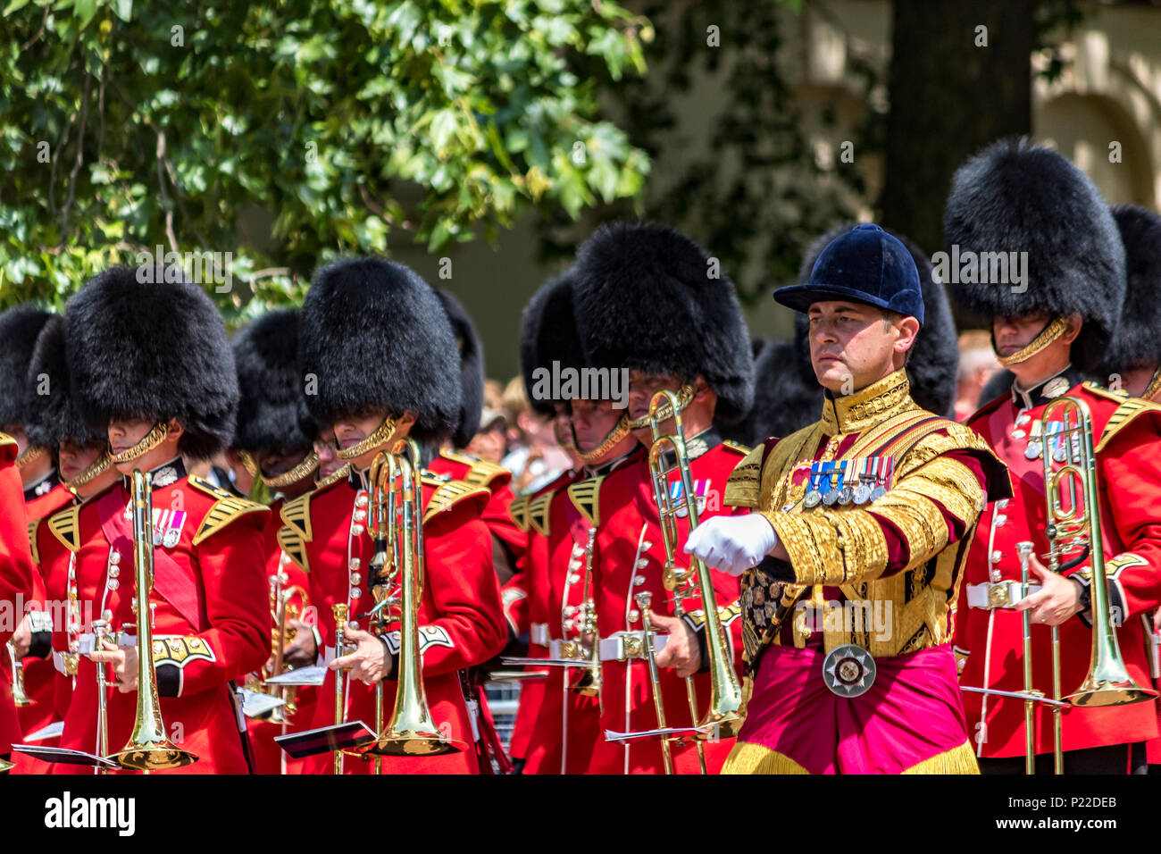 The Massed Bands of the Guards Division marching along The Mall at The Queen's Birthday Parade also known as Trooping The Colour, London, UK Stock Photo