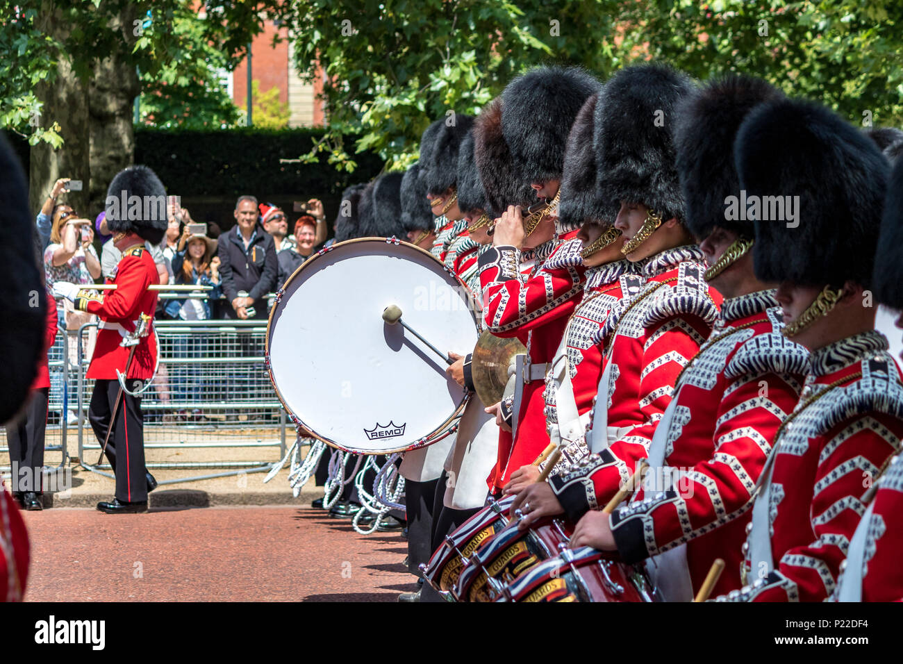 Drummers of the Massed Bands of the Guards Division march along The Mall at The Queen's Birthday Parade also known as Trooping The Colour, London, UK Stock Photo
