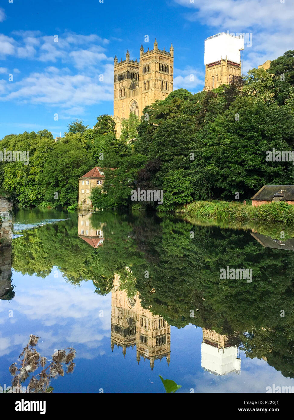 Perfect reflection of Durham Cathedral in the still water of the river